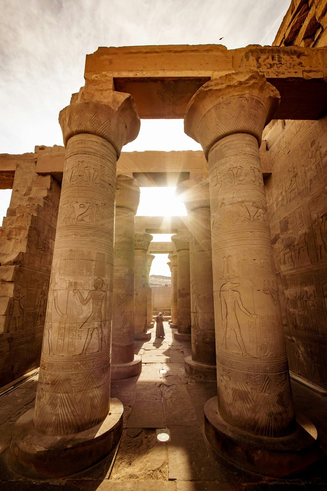 Hieroglyphic columns of an ancient Egyptian temple in Upper Egypt — Egyptian heritage context, not the medical campus