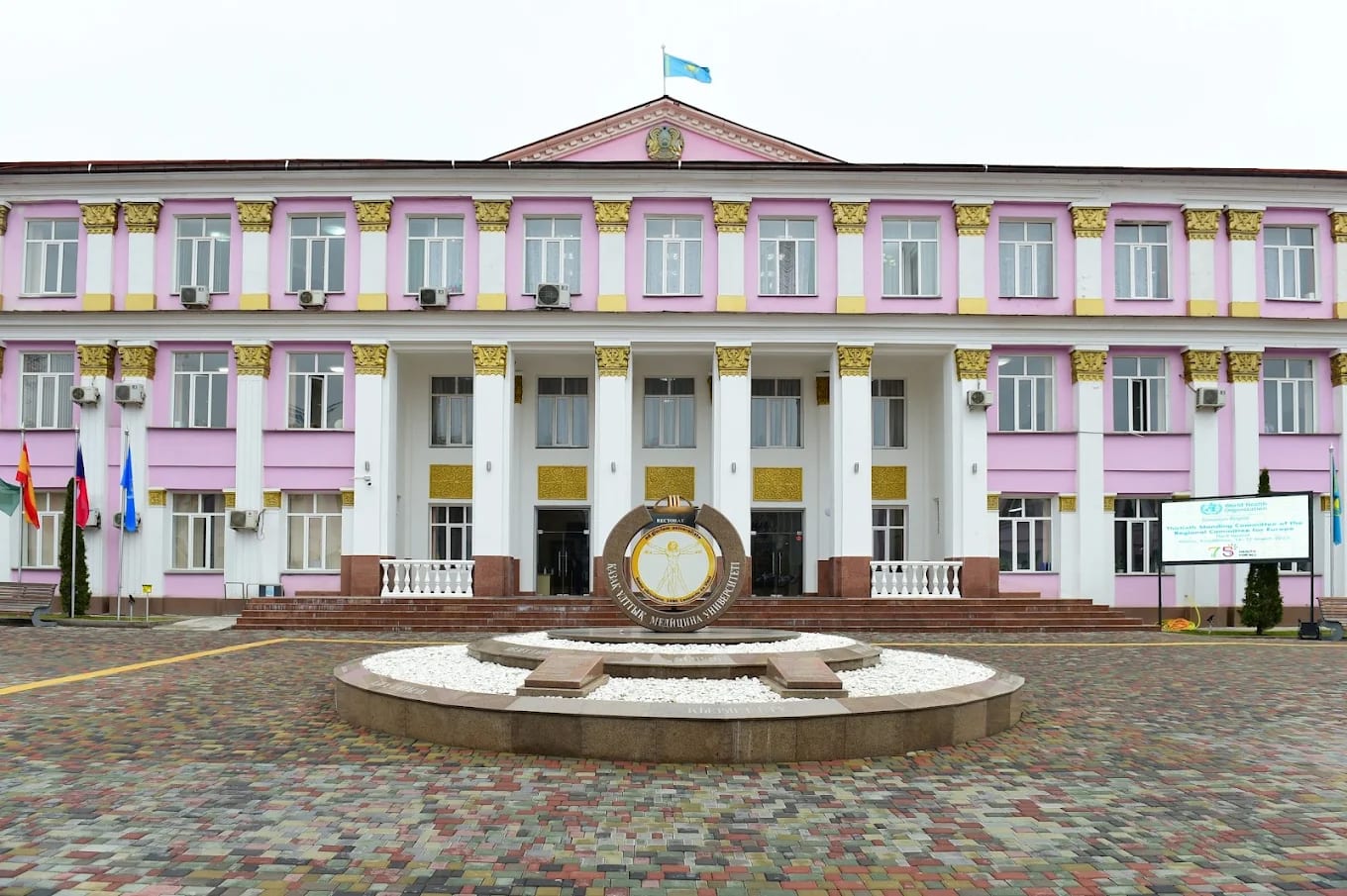The rose-pink historic main building of Asfendiyarov Kazakh National Medical University in Almaty