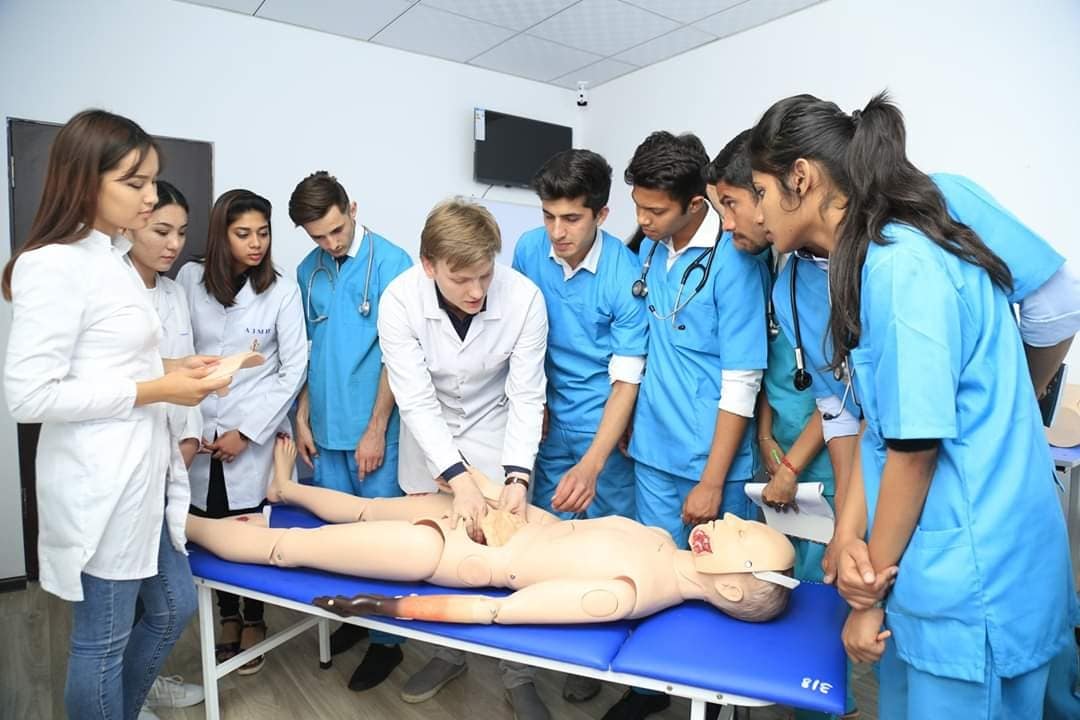 Students in a clinical skills training session at the Asian Medical Institute