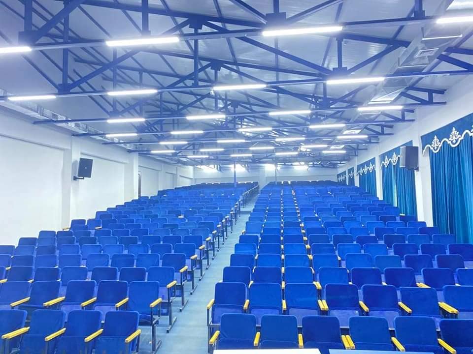 A large lecture hall with tiered seating at the Asian Medical Institute