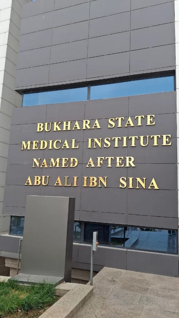 The 'Bukhara State Medical Institute named after Abu Ali ibn Sina' sign on the building
