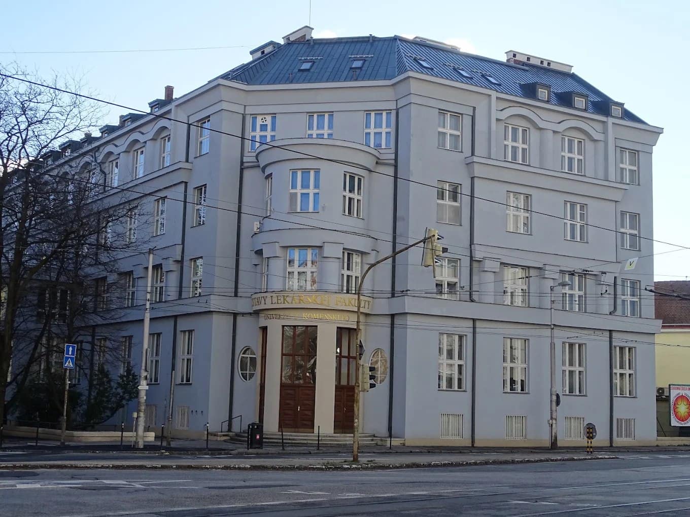 A Comenius University Faculty of Medicine building on a Bratislava street corner