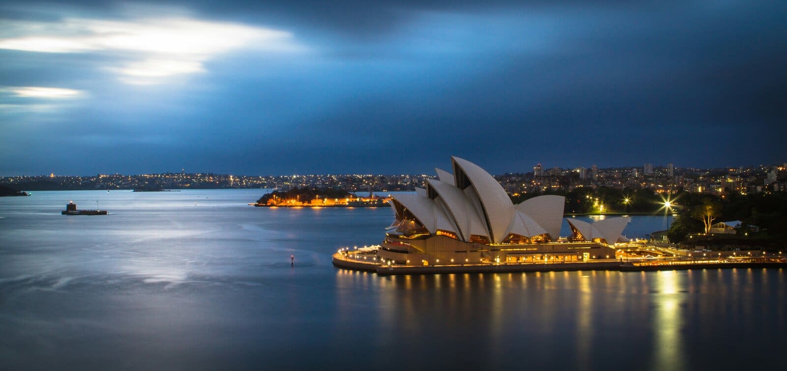 The Sydney Opera House and harbour lights at night, Australia