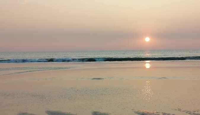 Sunset over the sea at Cox's Bazar beach, Bangladesh