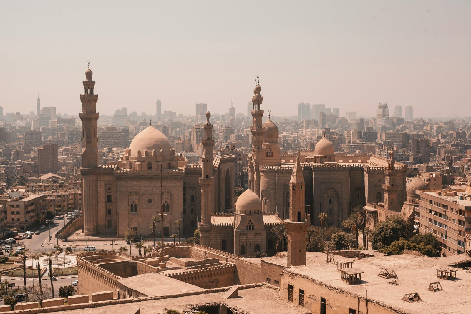 The Sultan Hassan and Al-Rifai mosques with the Cairo skyline, Egypt