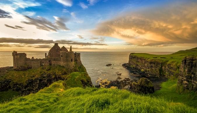 Coastal castle at sunset on the Irish coast