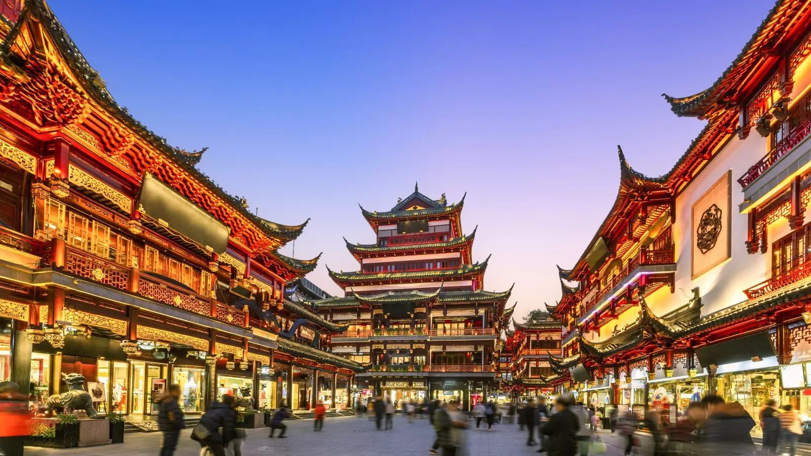 Yu Garden bazaar lit up at dusk in Shanghai, China