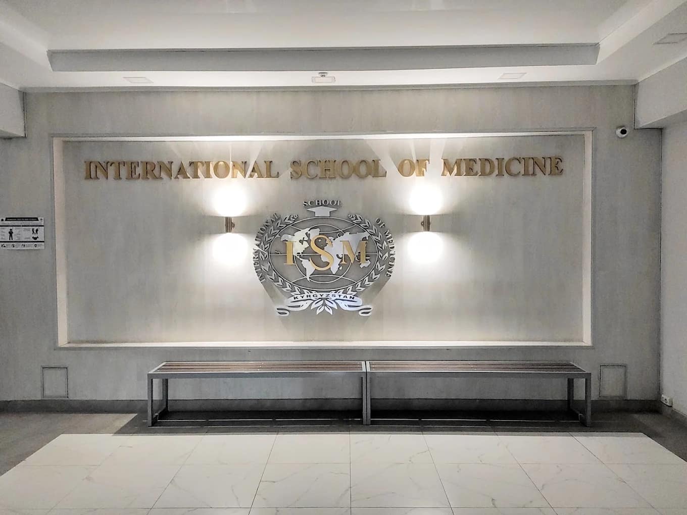 The 'International School of Medicine' signage and emblem inside the campus