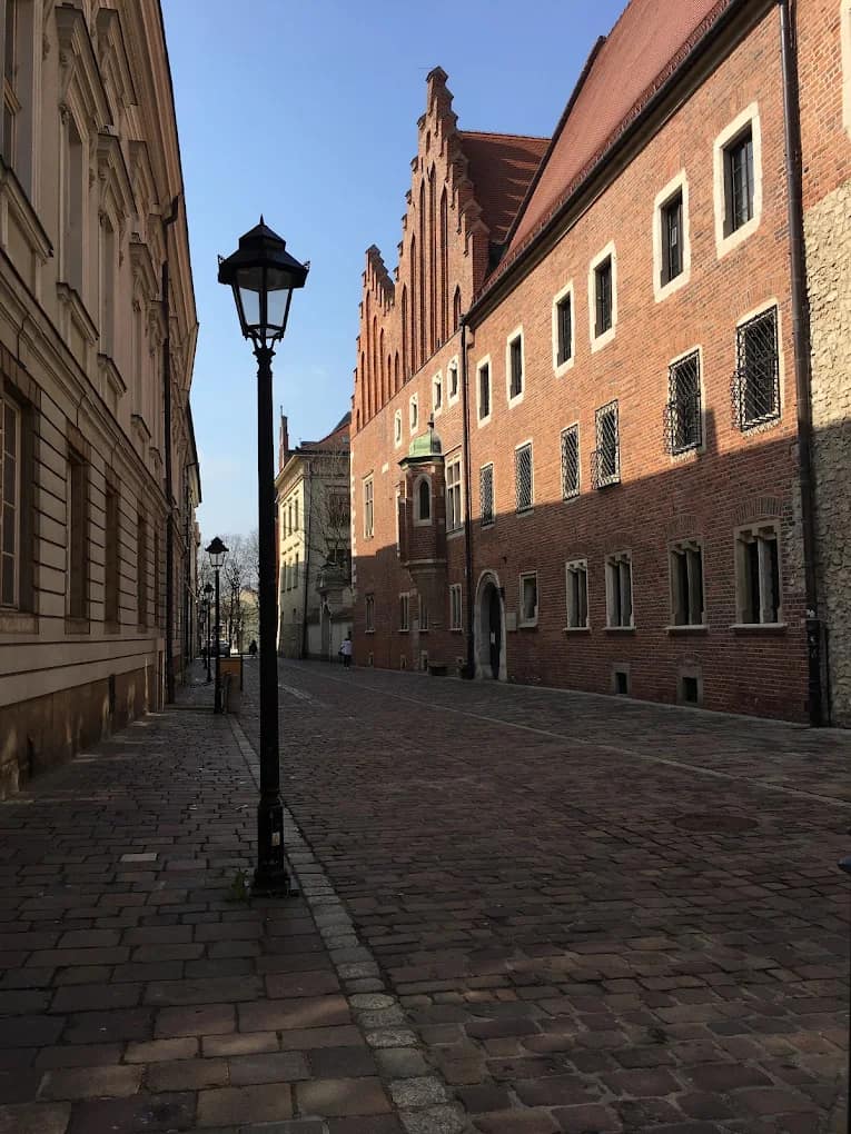 A historic Jagiellonian University building on a Kraków street