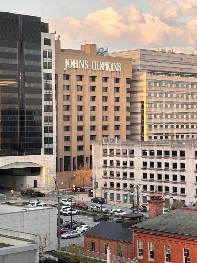 A Johns Hopkins Hospital building in East Baltimore with the Johns Hopkins name displayed