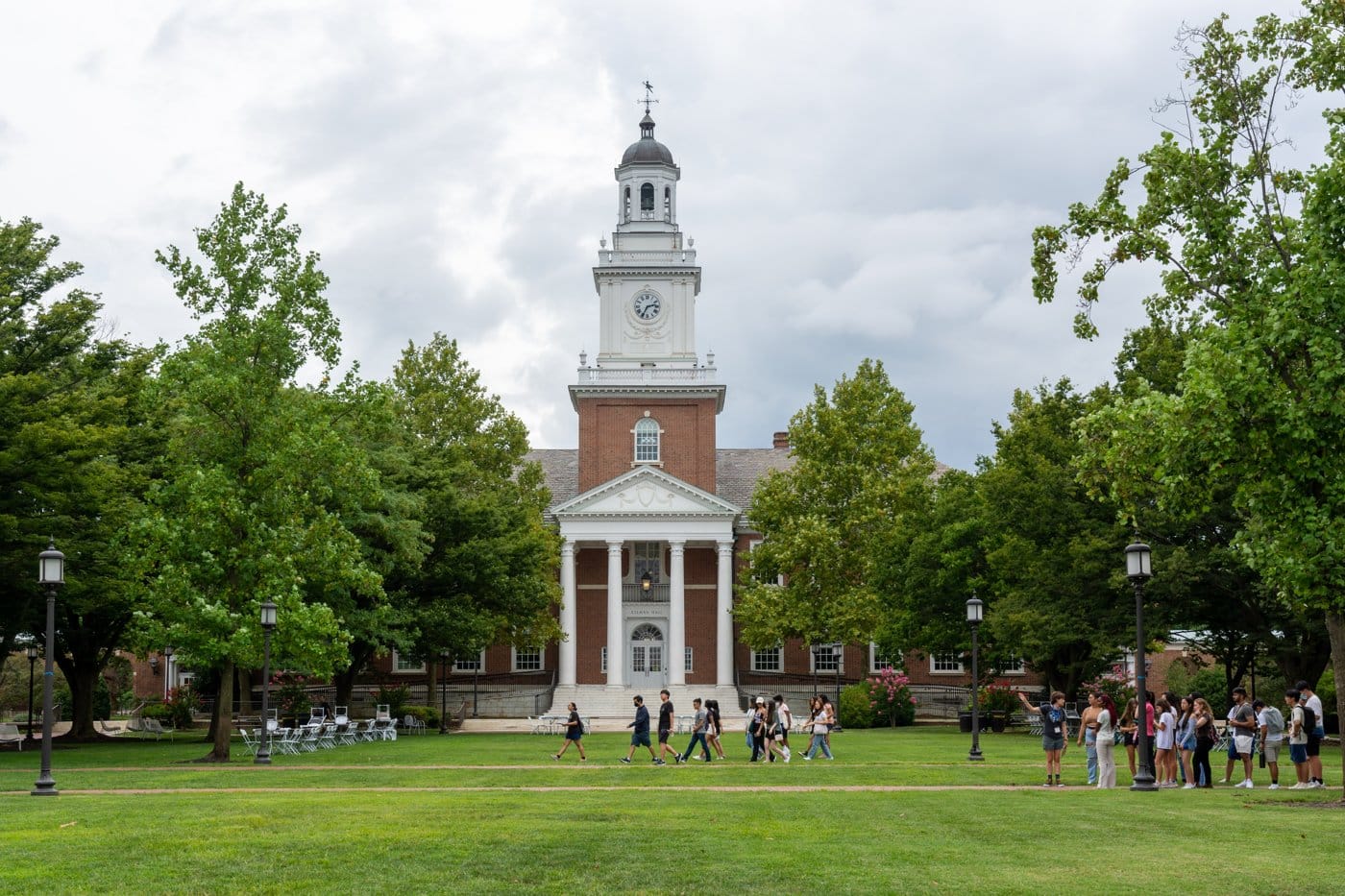 Students on the lawn in front of Gilman Hall at Johns Hopkins University