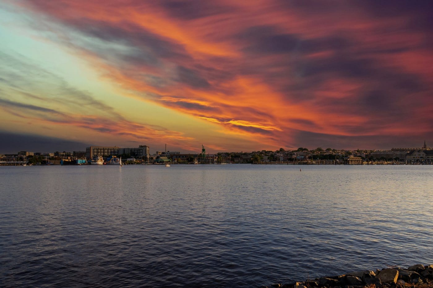 The Baltimore skyline at sunset over the water