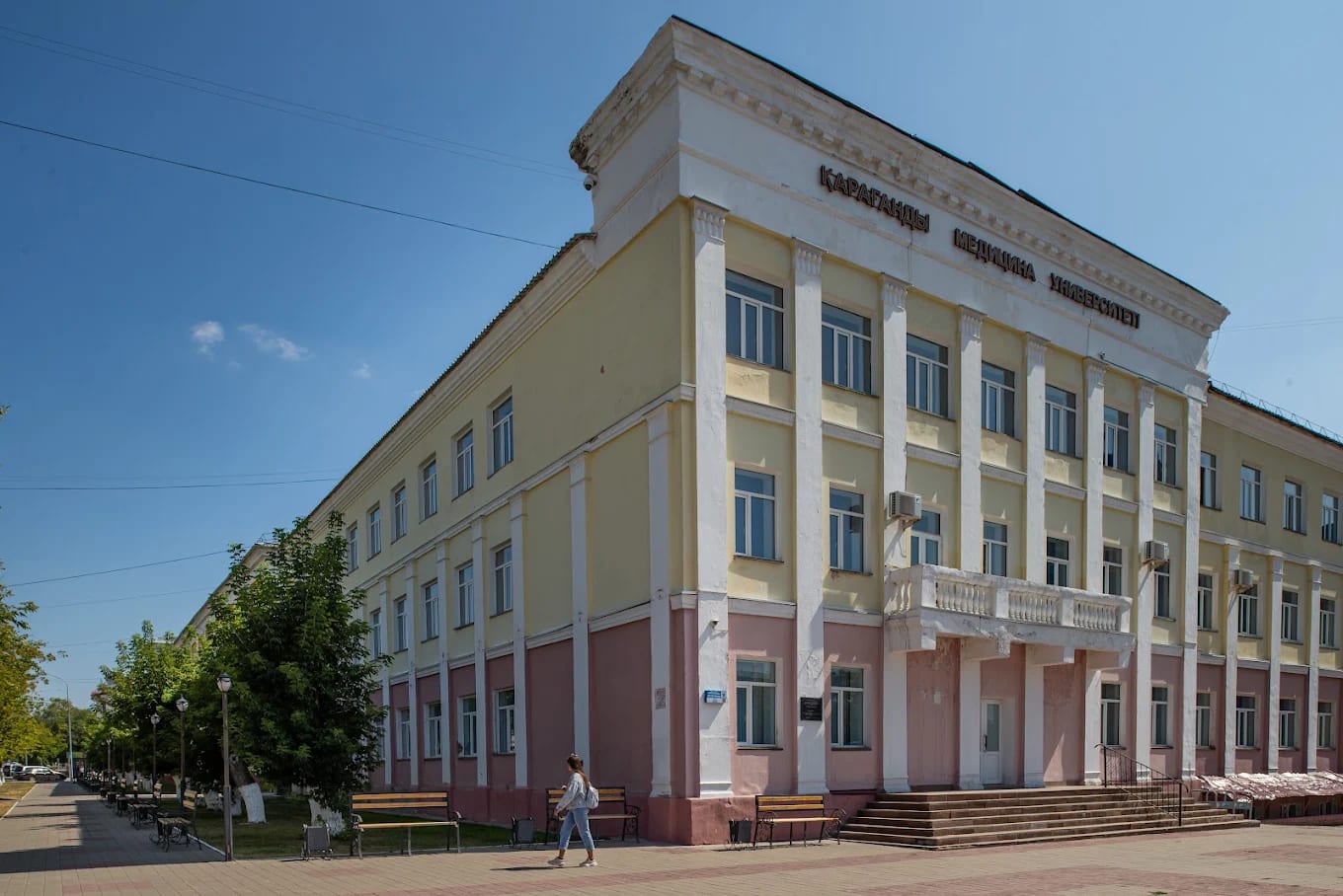 The historic main building of Karaganda Medical University with its Kazakh signage in Karaganda