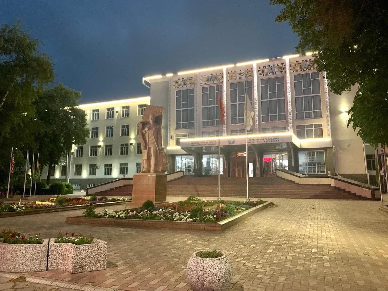 The Kyrgyz State Medical Academy main building illuminated in the evening