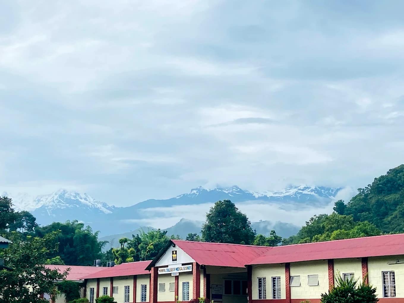 The Manipal College of Medical Sciences campus with the Annapurna range behind