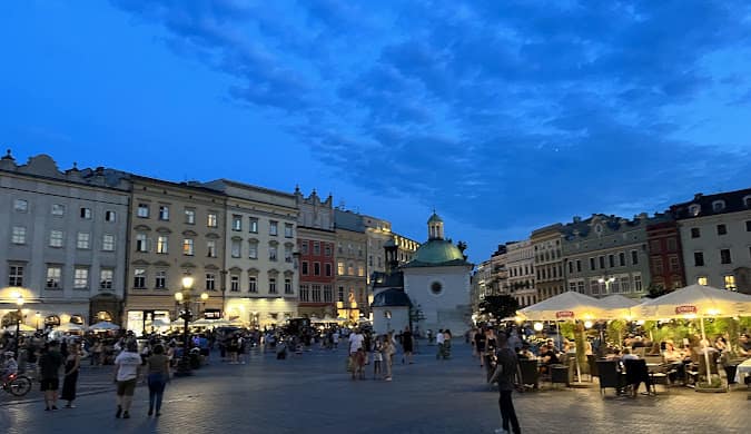 A lively market square in a Polish city