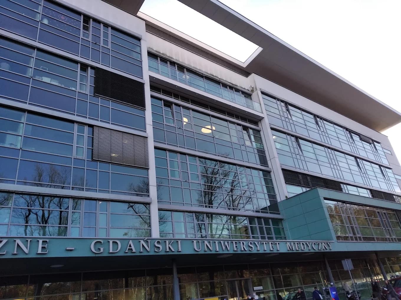 A modern glass building on the Medical University of Gdańsk campus