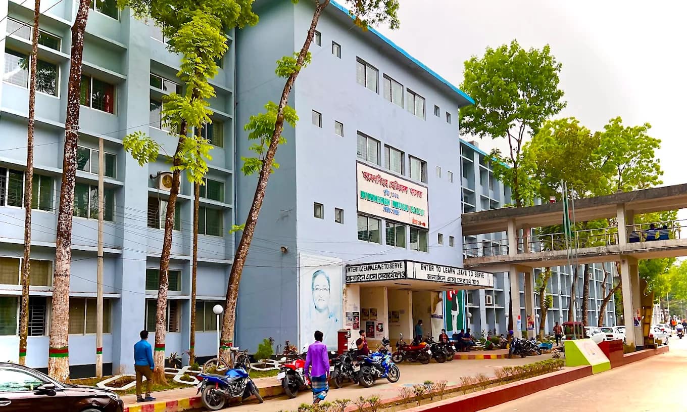 Academic building of Mymensingh Medical College bearing the motto 'Enter to Learn, Leave to Serve'