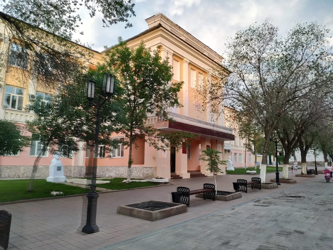 A corner view of the Orenburg State Medical University main building in the evening