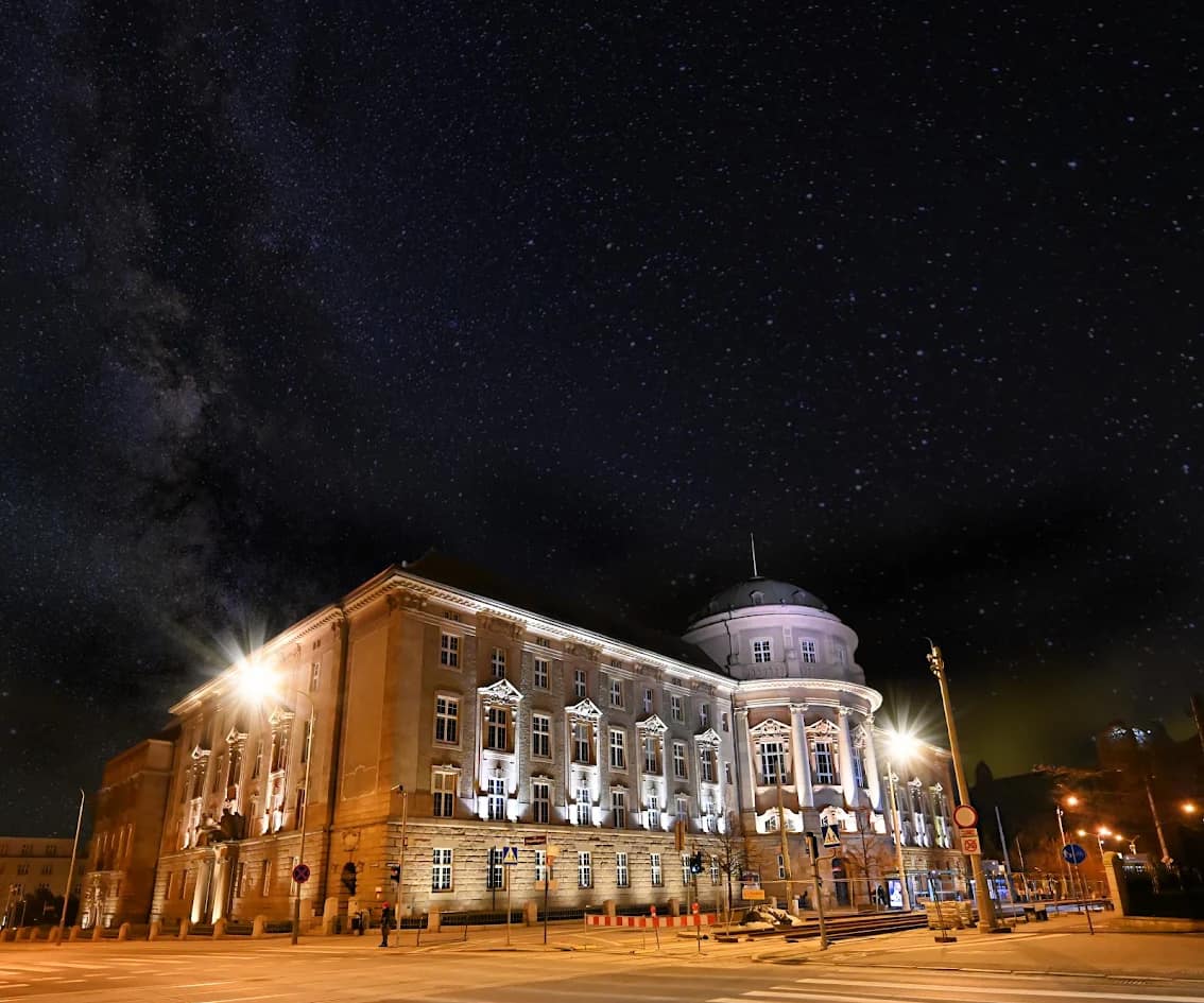 The domed Collegium of Poznań University of Medical Sciences illuminated at night