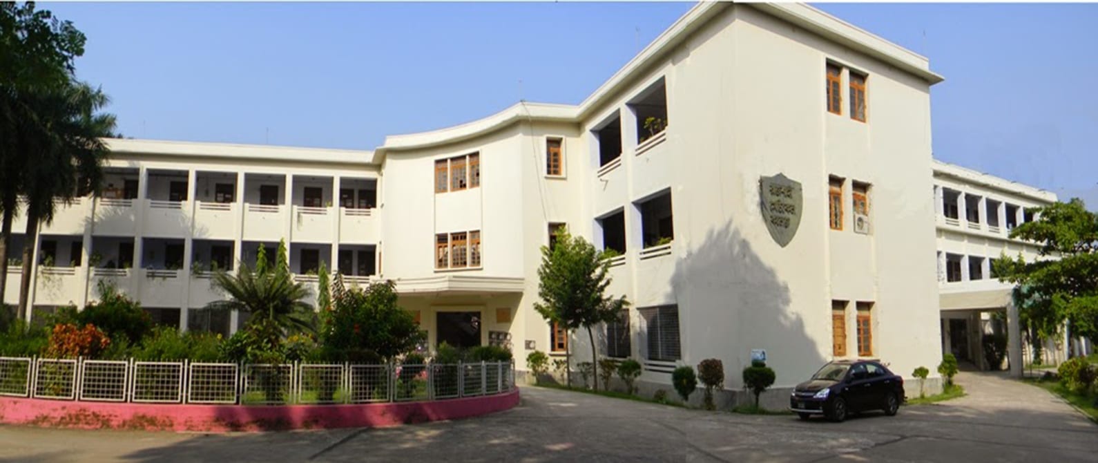 Academic building of Rajshahi Medical College with its crest