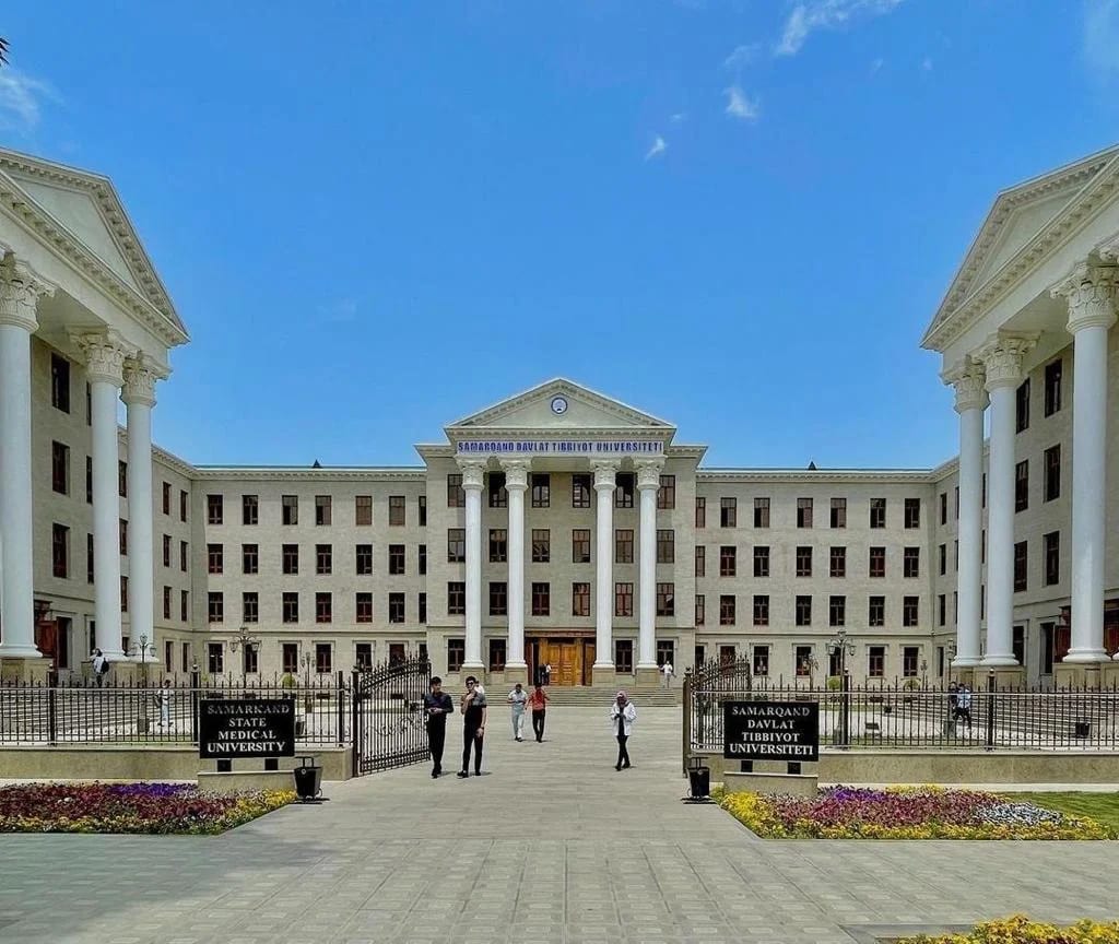 The neoclassical main building of Samarkand State Medical University with students in the forecourt