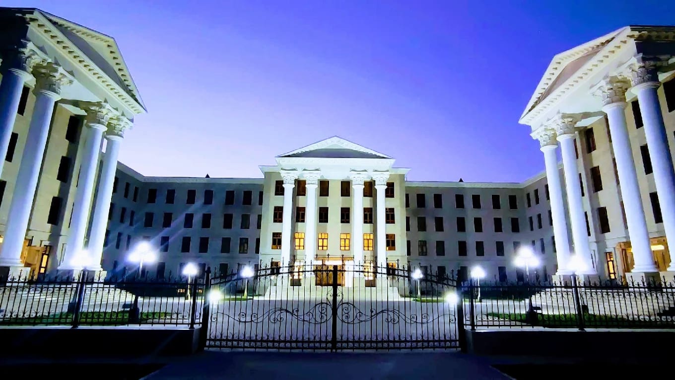 Samarkand State Medical University building illuminated at dusk