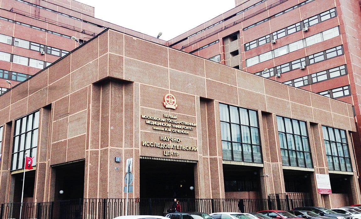 A Sechenov University building (the Research Centre) in Moscow with Russian signage and the university emblem