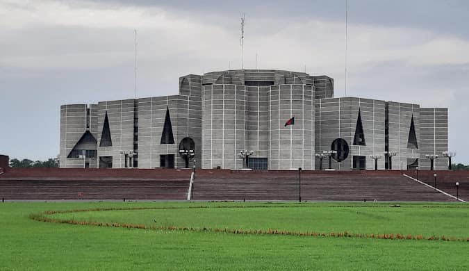 Jatiya Sangsad Bhaban, the National Parliament House of Bangladesh, near the college in Sher-e-Bangla Nagar