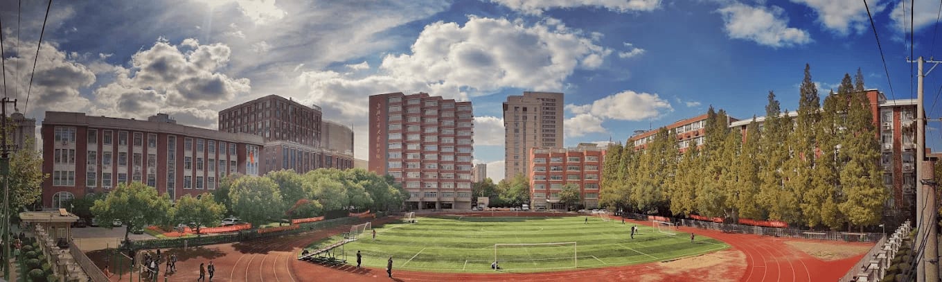 A panoramic view of the Shanghai Jiao Tong University School of Medicine campus with its athletics track and buildings