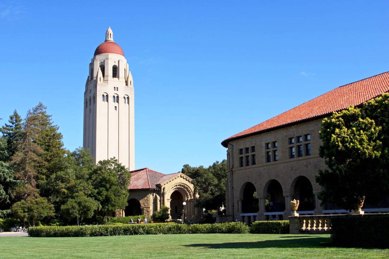 Hoover Tower and a sandstone building at Stanford University