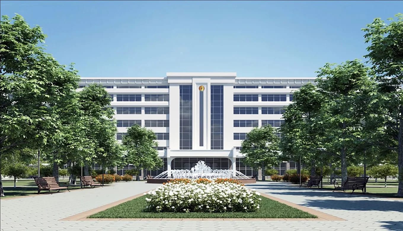 A Tashkent Medical Academy campus building with a fountain and gardens