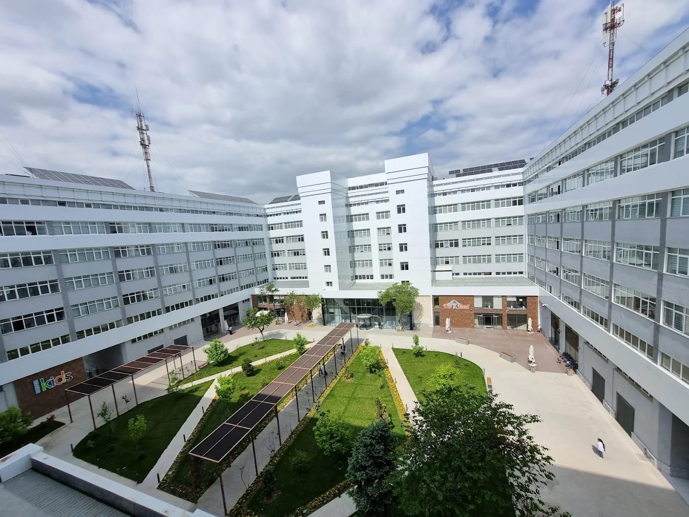 The Tashkent Medical Academy campus courtyard with landscaped gardens
