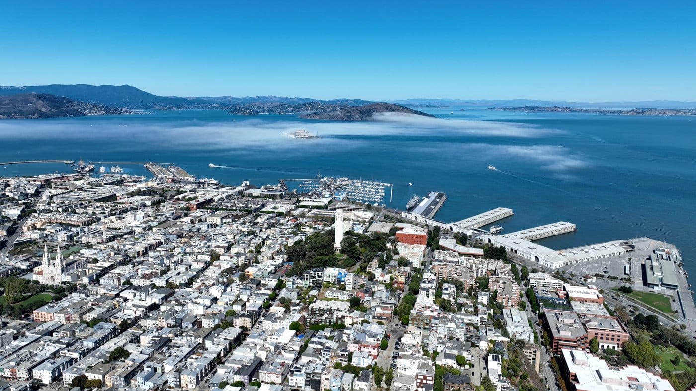 An aerial view of a San Francisco neighbourhood and the bay