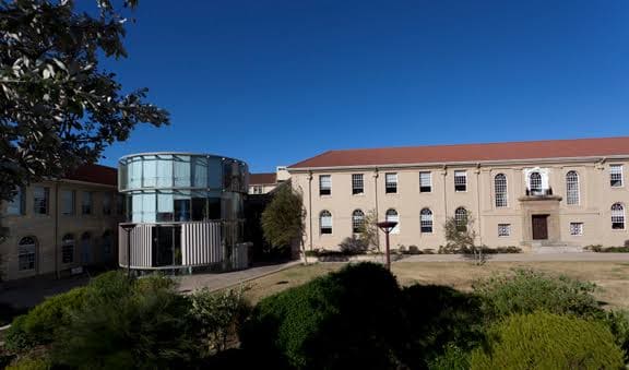 A University of Cape Town health-sciences campus building with its glass rotunda and courtyard