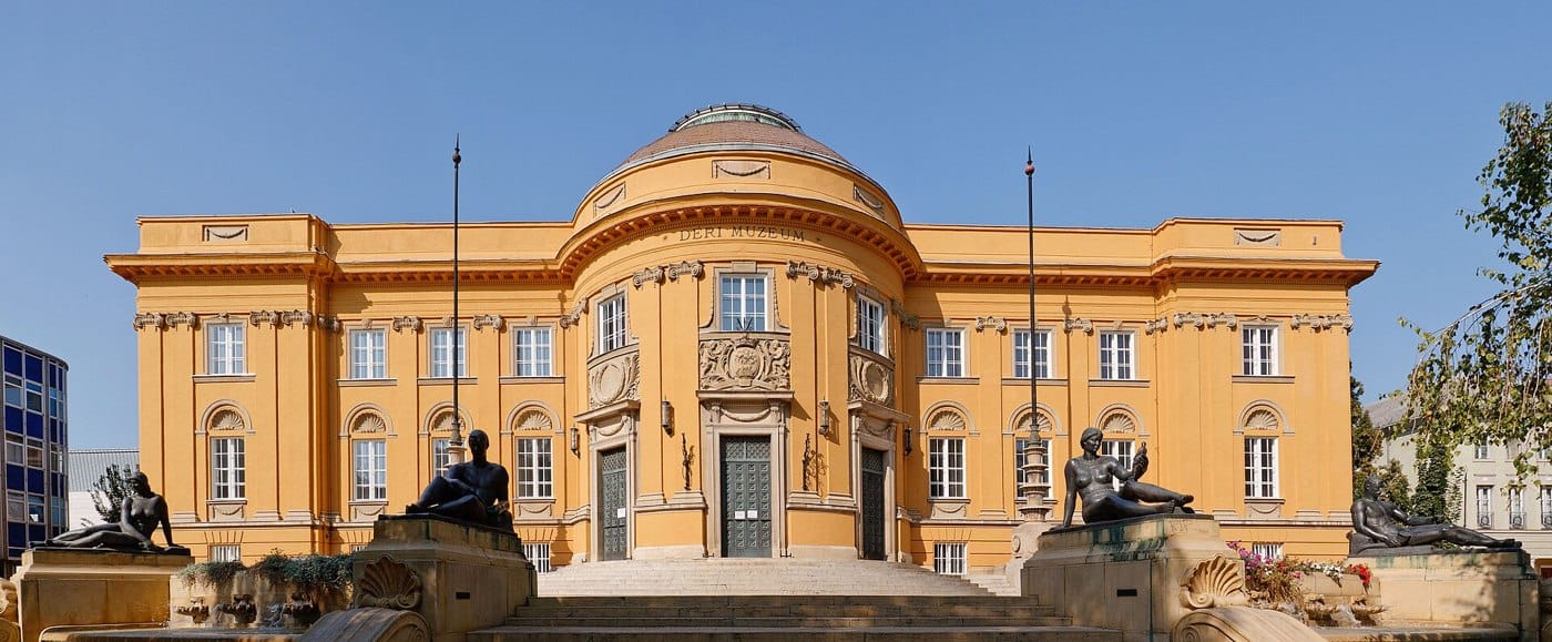 A historic yellow domed building in Debrecen, Hungary