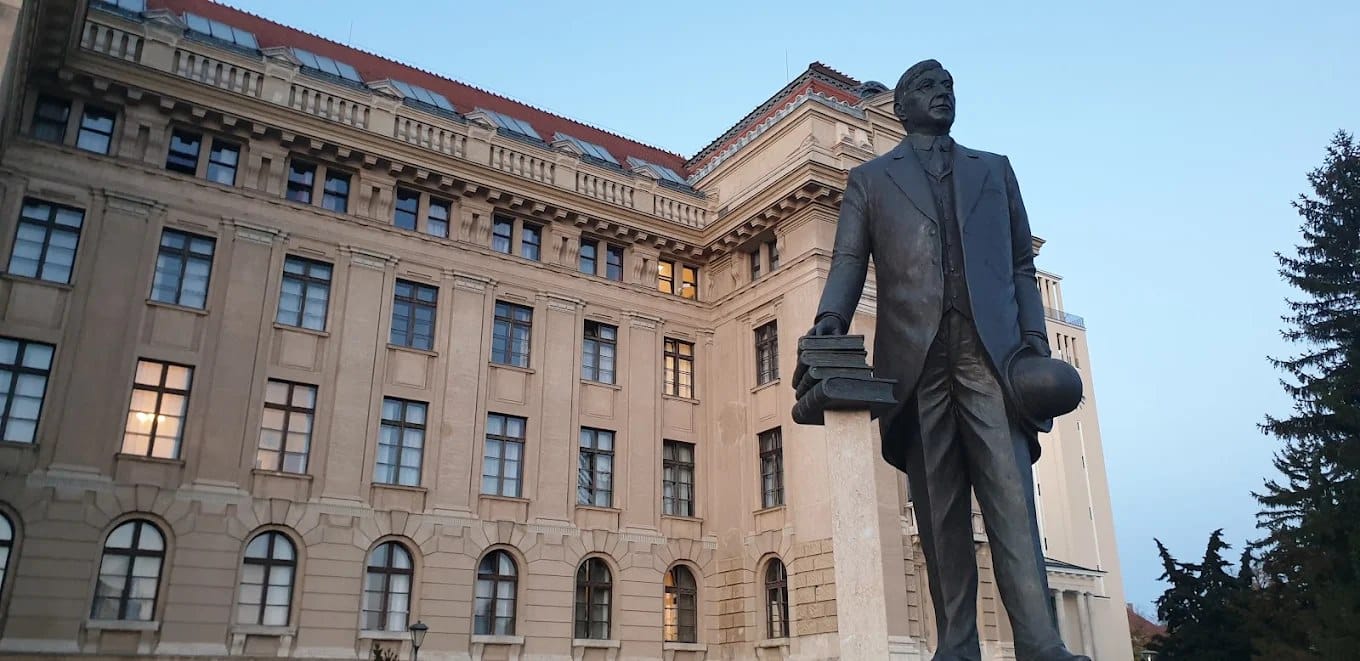 A statue in front of the University of Debrecen Main Building