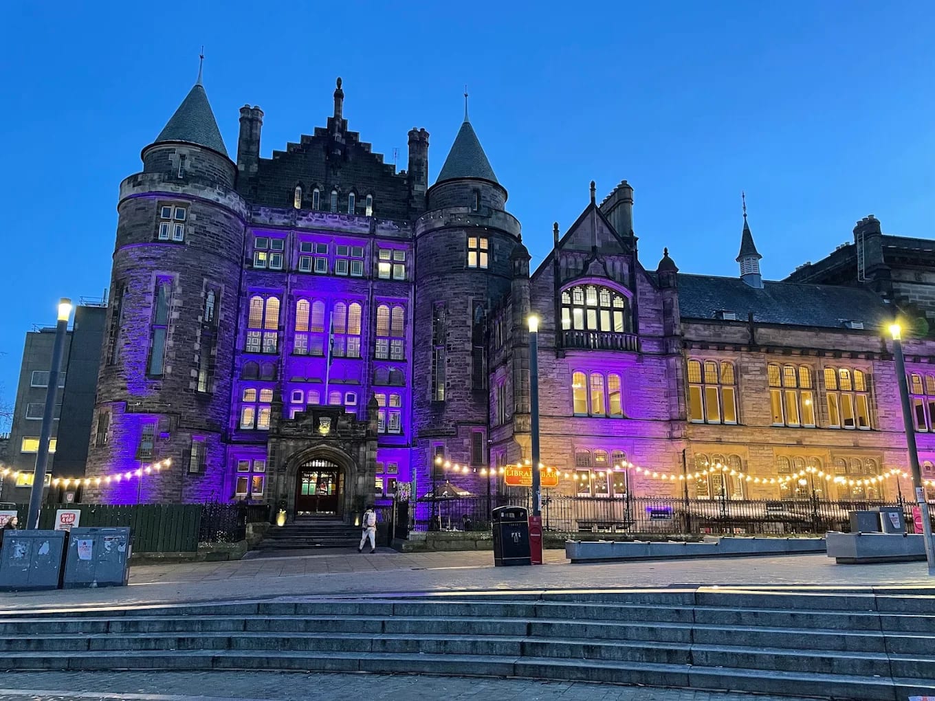 Teviot Row House, the University of Edinburgh students' union, lit up at dusk