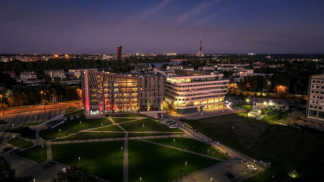 An aerial view of the University of Latvia Academic Centre campus at dusk