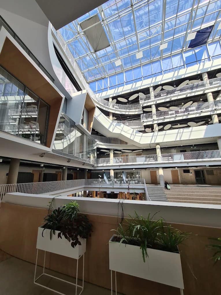 The glass atrium inside a University of Latvia Academic Centre building