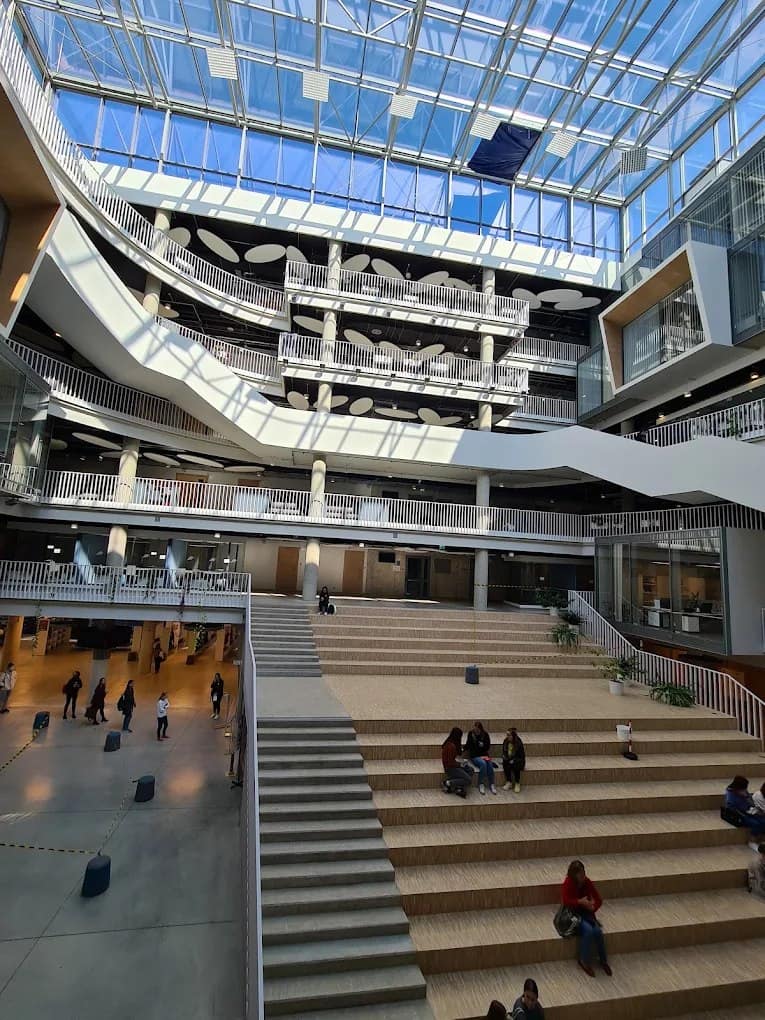 A modern atrium and staircase at the University of Latvia