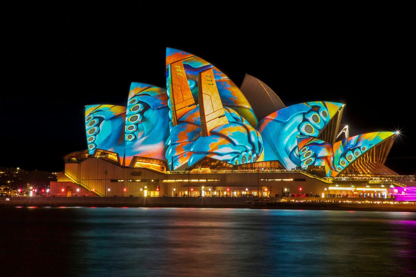 The Sydney Opera House illuminated with coloured projections at night, Australia