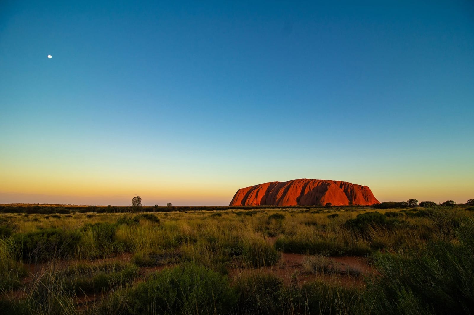 Uluru (Ayers Rock) at dusk in the Northern Territory, Australia — travel context, about 2,000 km from Melbourne
