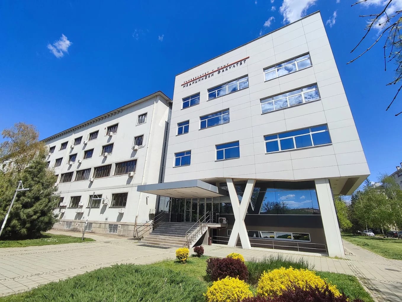 A modern building of the University of Niš Faculty of Medicine with its signage