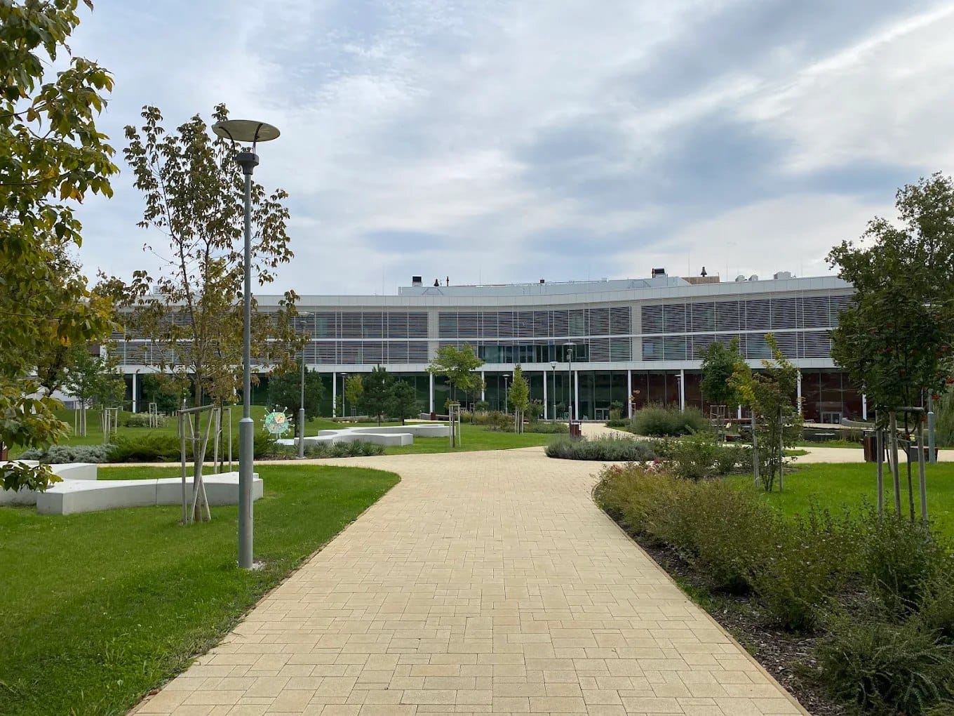 A University of Pécs campus building and landscaped garden