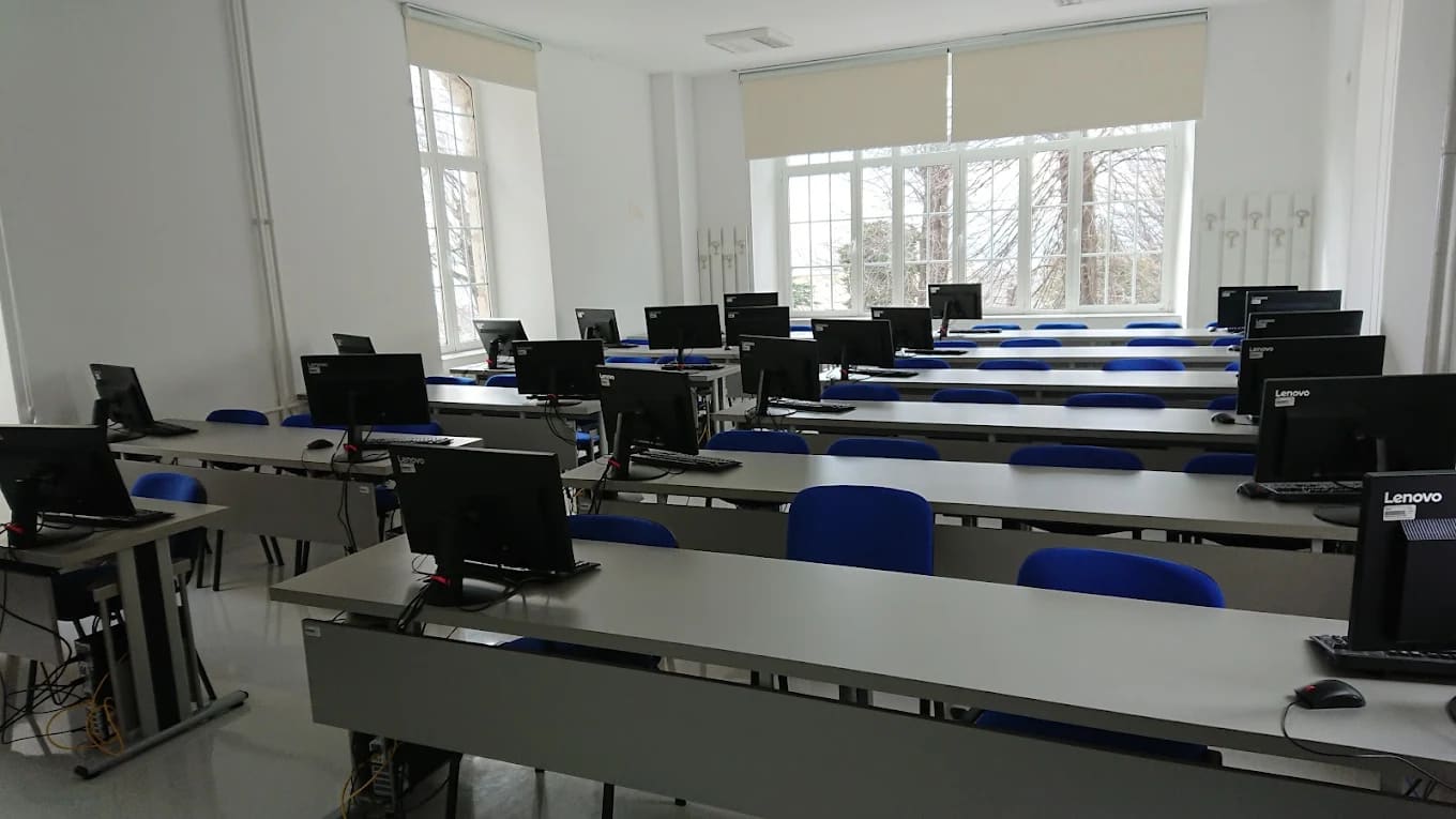 A teaching computer laboratory with rows of desktop workstations at the University of Rijeka Faculty of Medicine