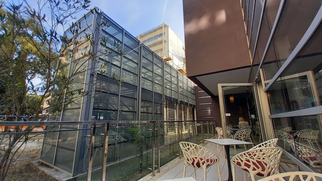 A modern glass campus building with a cafe terrace at the University of Split, Croatia