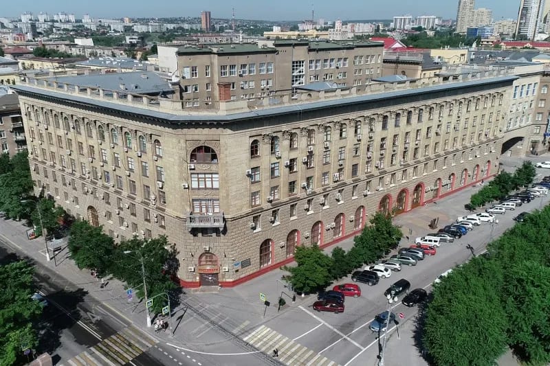 An aerial view of the Volgograd State Medical University main building over the Volgograd cityscape