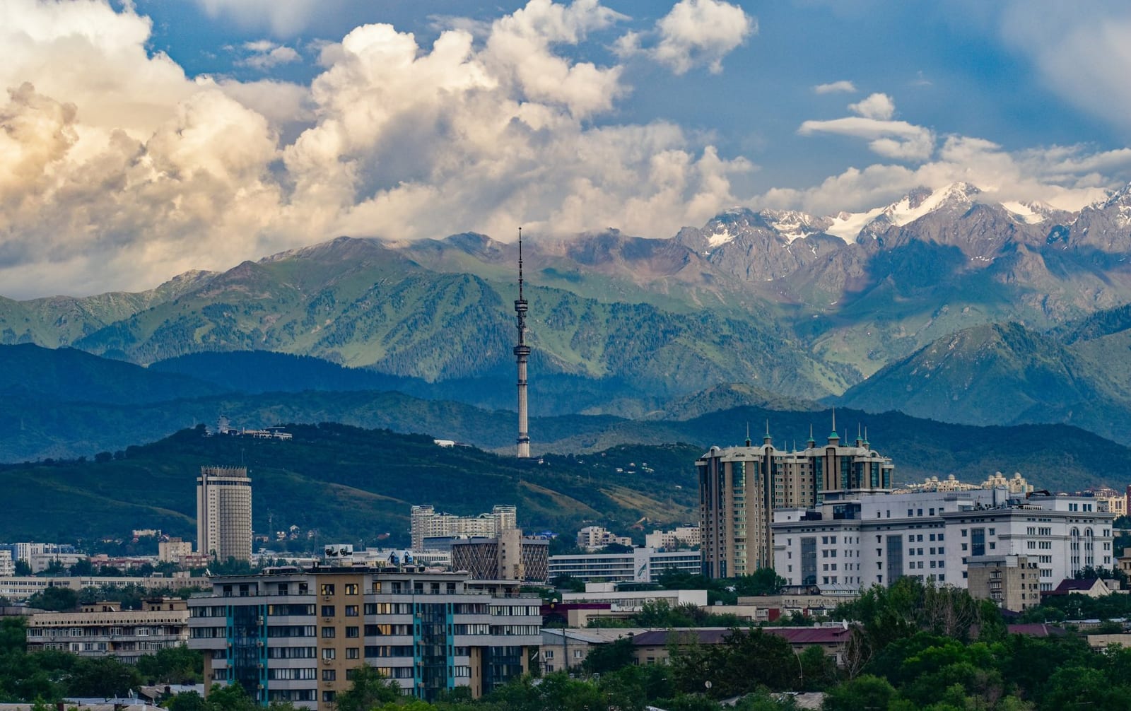 The Almaty skyline with the Kok-Tobe TV tower and the snow-capped Alatau mountains behind (Almaty, southern Kazakhstan — not Aktobe)