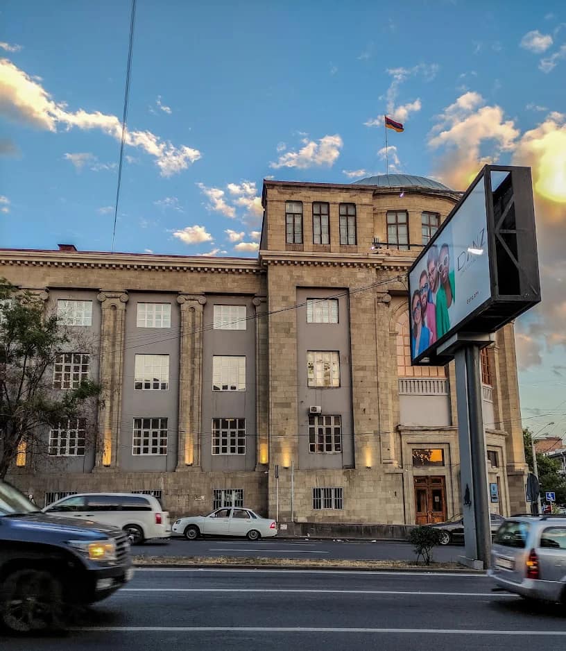 Main building of Yerevan State Medical University with a digital display